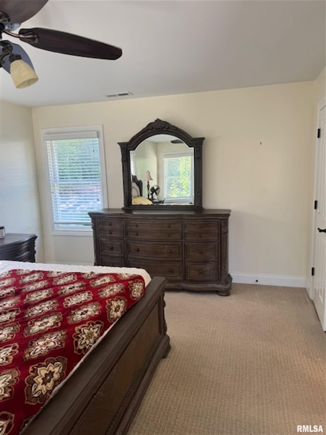 3119 15th St Unit C, Moline, IL 61265 - bedroom featuring light colored carpet and ceiling fan