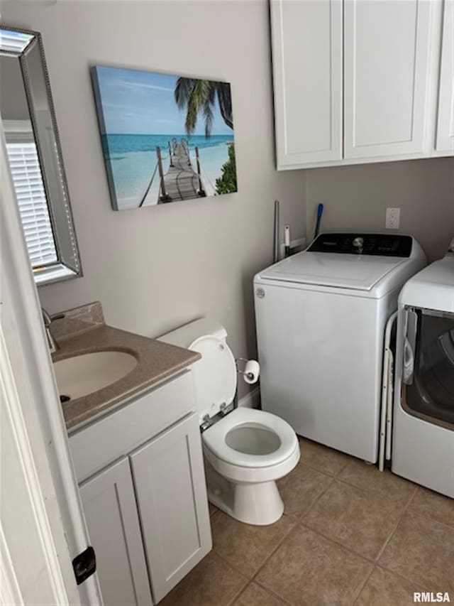 3119 15th St Unit C, Moline, IL 61265 - half bathroom featuring independent washer and dryer, vanity, and tile patterned flooring