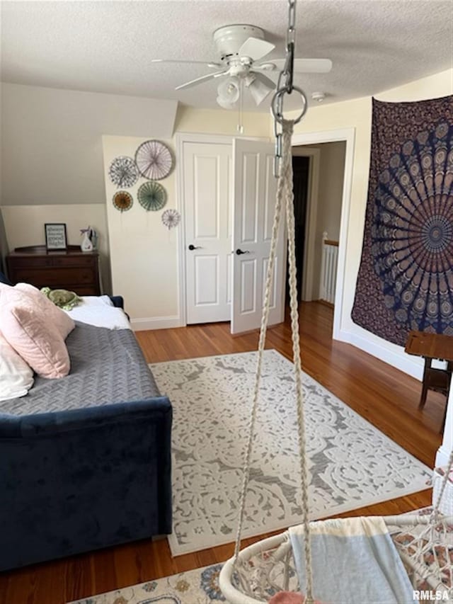 3119 15th St Unit C, Moline, IL 61265 - bedroom featuring wood finished floors, ceiling fan, and a textured ceiling