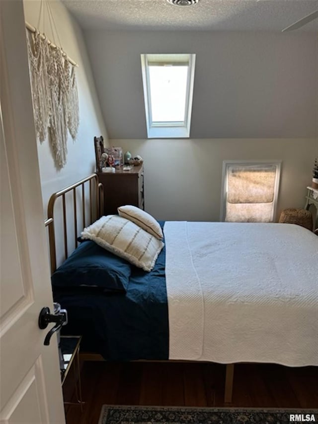 3119 15th St Unit C, Moline, IL 61265 - bedroom featuring wood finished floors and a textured ceiling