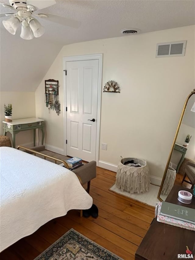 3119 15th St Unit C, Moline, IL 61265 - bedroom featuring hardwood / wood-style flooring, a ceiling fan, a textured ceiling, and vaulted ceiling