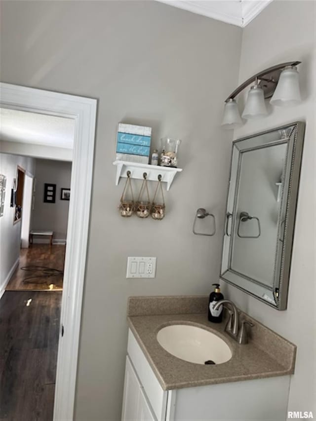 3119 15th St Unit C, Moline, IL 61265 - bathroom with vanity, crown molding, and wood finished floors