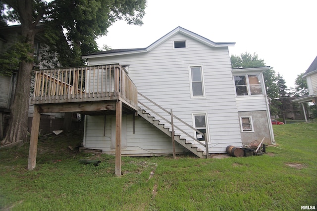 1116 Arlington Ave, Davenport, IA 52803 - back of house with stairway, a lawn, and a wooden deck