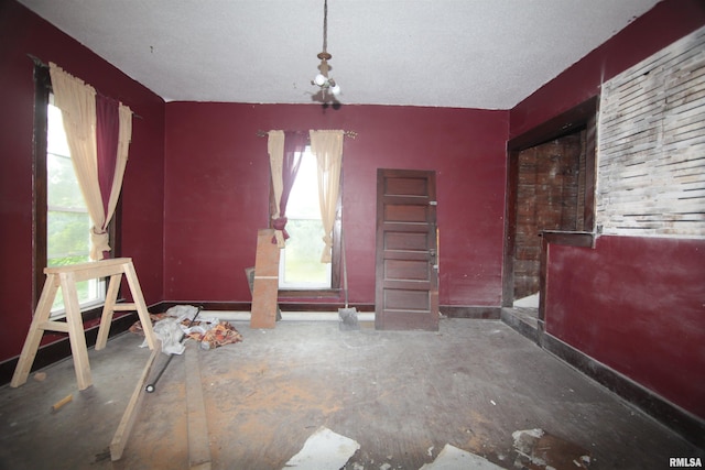 1116 Arlington Ave, Davenport, IA 52803 - unfurnished dining area with baseboards