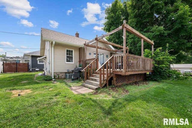 1620 24th St, Moline, IL 61265 - back of property featuring a lawn, a wooden deck, a chimney, and roof with shingles