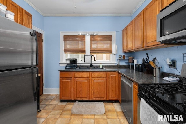 1620 24th St, Moline, IL 61265 - kitchen featuring appliances with stainless steel finishes, brown cabinets, dark countertops, crown molding, and stone finish flooring
