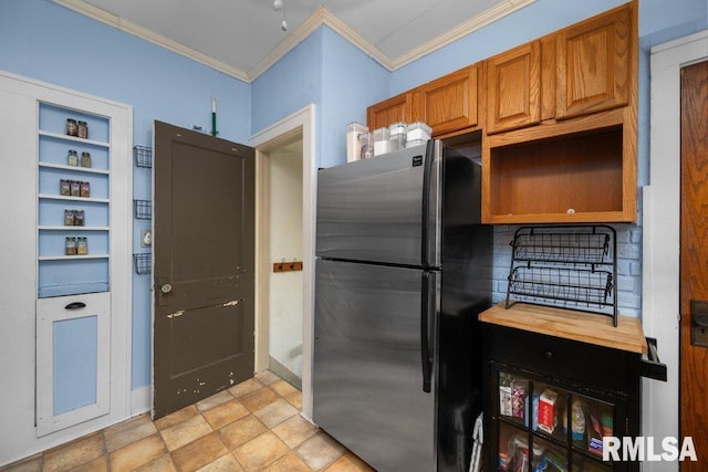 1620 24th St, Moline, IL 61265 - kitchen featuring freestanding refrigerator, crown molding, open shelves, brown cabinets, and decorative backsplash