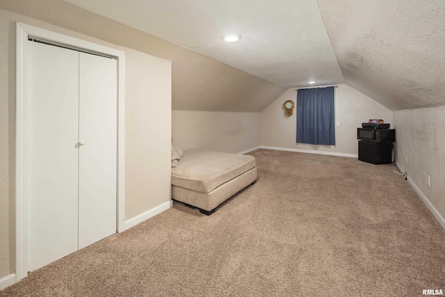 419 50th St, Moline, IL 61265 - sitting room featuring vaulted ceiling, carpet flooring, and a textured ceiling