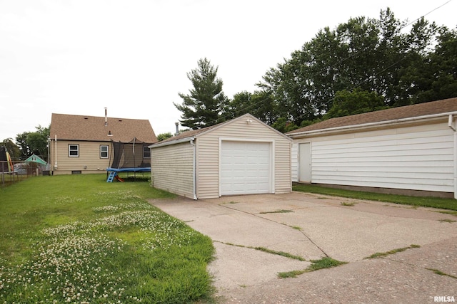 419 50th St, Moline, IL 61265 - detached garage with concrete driveway and a trampoline