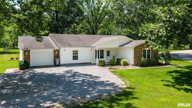 4182 Baptist Camp Rd, Carterville, IL 62918 - single story home with an attached garage, stone siding, driveway, and a front yard