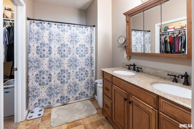 4182 Baptist Camp Rd, Carterville, IL 62918 - full bathroom featuring double vanity, a spacious closet, and a shower with curtain