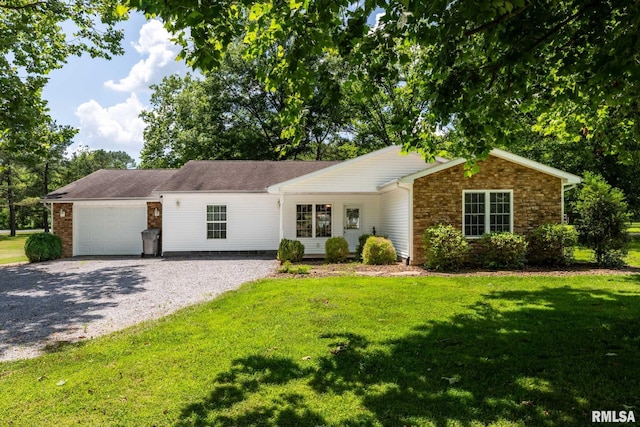 4182 Baptist Camp Rd, Carterville, IL 62918 - ranch-style home with gravel driveway, an attached garage, a front yard, and stone siding