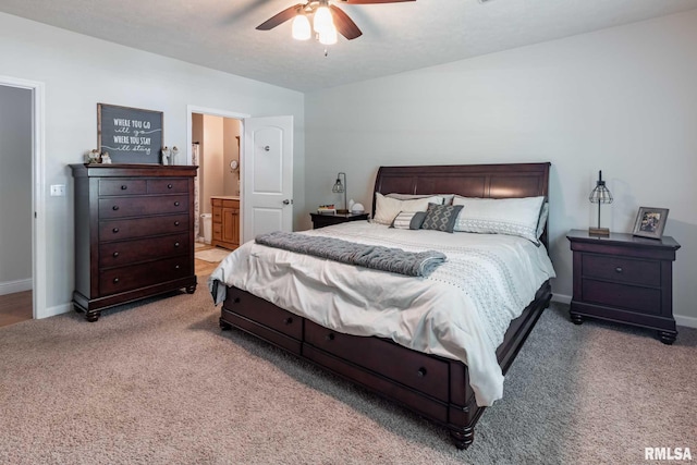4182 Baptist Camp Rd, Carterville, IL 62918 - carpeted bedroom with ensuite bath and a ceiling fan