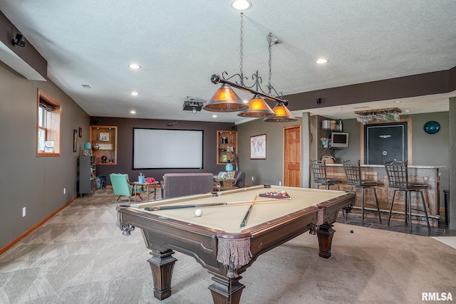 27062 238th St, Le Claire, IA 52753 - playroom featuring carpet floors, pool table, bar area, recessed lighting, and a textured ceiling