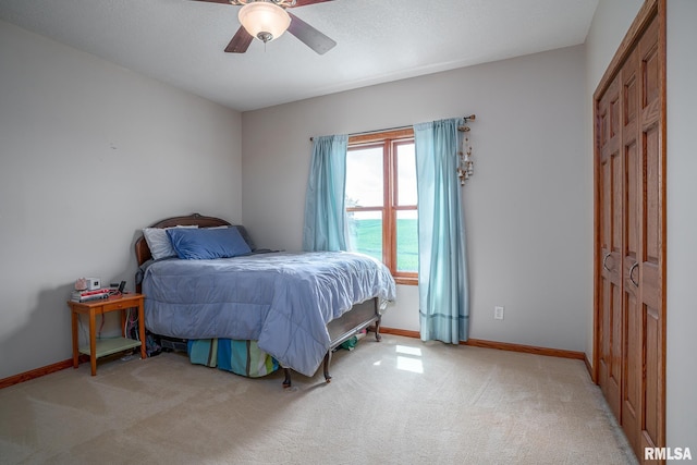 27062 238th St, Le Claire, IA 52753 - bedroom with light carpet and ceiling fan