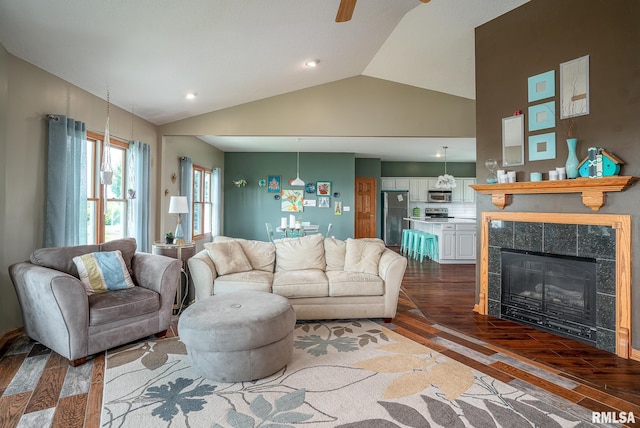 27062 238th St, Le Claire, IA 52753 - living area with dark wood-type flooring, lofted ceiling, ceiling fan, a fireplace, and recessed lighting