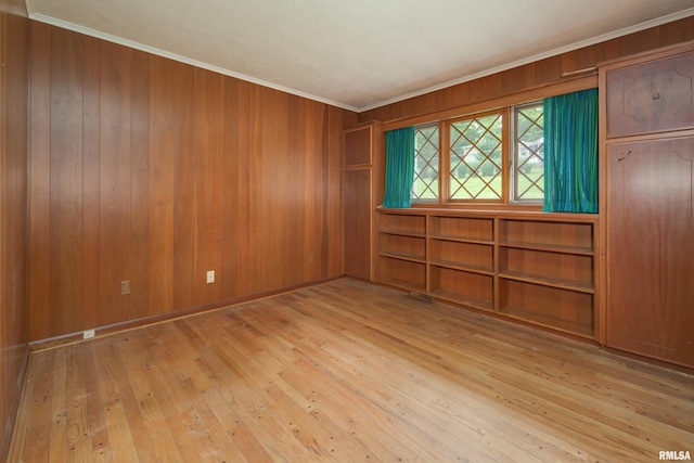 1427 35th Ave, Rock Island, IL 61201 - empty room with hardwood / wood-style flooring, crown molding, and wood walls