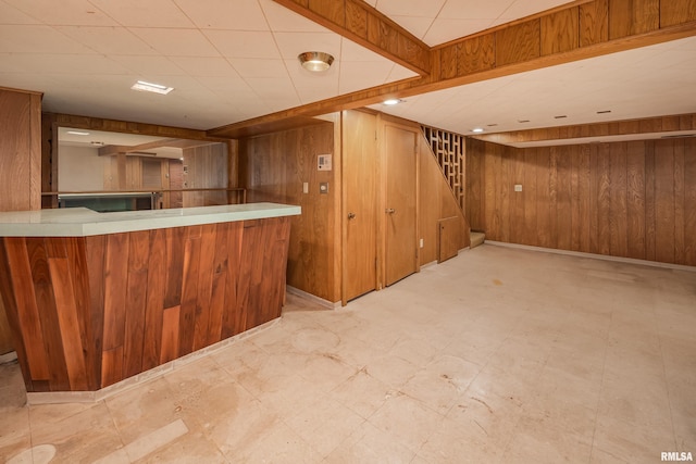 1427 35th Ave, Rock Island, IL 61201 - indoor bar featuring tile patterned floors, wood walls, and stairs