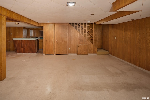 1427 35th Ave, Rock Island, IL 61201 - finished below grade area featuring bar, wood walls, light floors, and stairs