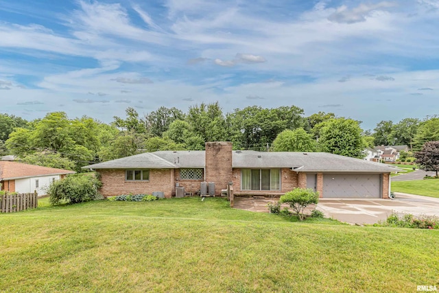 1427 35th Ave, Rock Island, IL 61201 - ranch-style home with driveway, brick siding, a garage, and a chimney