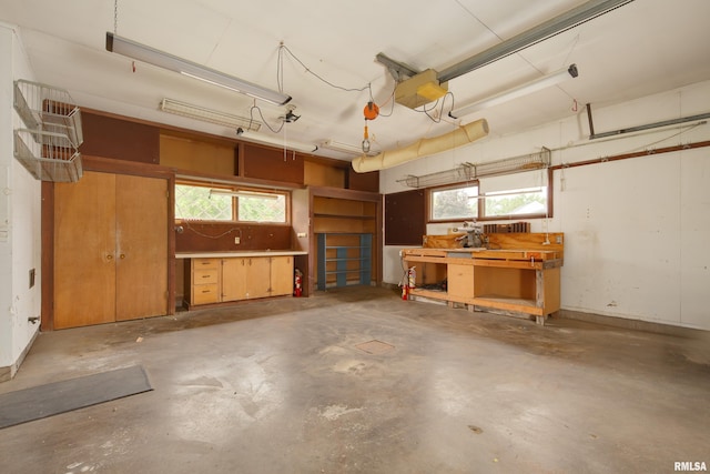 1427 35th Ave, Rock Island, IL 61201 - garage featuring a workshop area and a garage door opener
