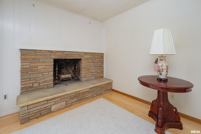 1427 35th Ave, Rock Island, IL 61201 - living area with light wood-style floors, a fireplace, and ornamental molding