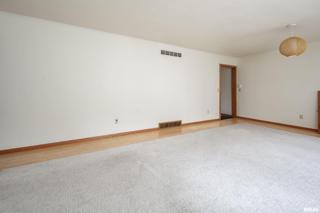 1427 35th Ave, Rock Island, IL 61201 - spare room with light wood-style flooring and crown molding
