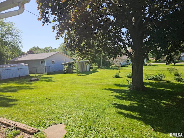 509 W 9th St, Tipton, IA 52772 - view of yard with a storage shed