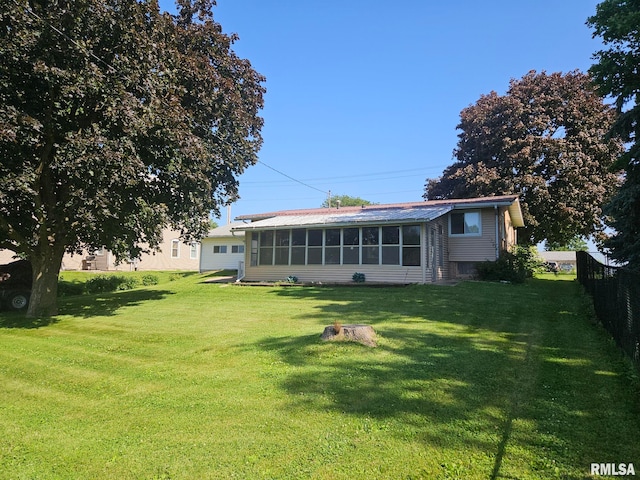 509 W 9th St, Tipton, IA 52772 - back of house with a sunroom