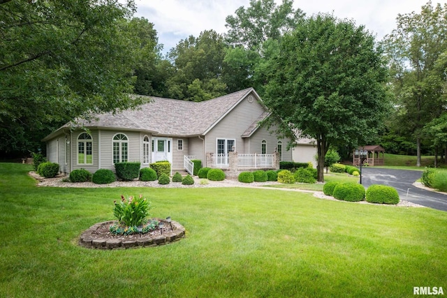10415 Chayla Rd, Marion, IL 62959 - single story home with a front lawn, a gazebo, and roof with shingles