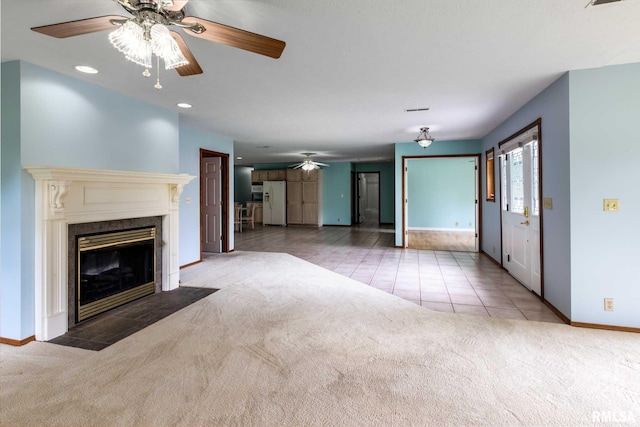 10415 Chayla Rd, Marion, IL 62959 - unfurnished living room featuring carpet, ceiling fan, tile patterned flooring, a premium fireplace, and recessed lighting