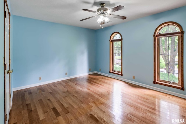 10415 Chayla Rd, Marion, IL 62959 - unfurnished room featuring healthy amount of natural light, wood finished floors, and ceiling fan