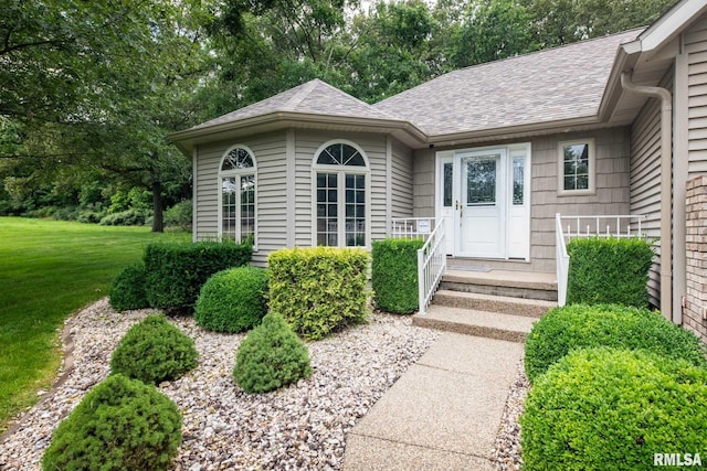 10415 Chayla Rd, Marion, IL 62959 - doorway to property featuring a shingled roof and a lawn