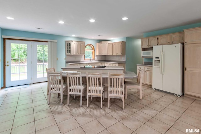 10415 Chayla Rd, Marion, IL 62959 - kitchen featuring white appliances, a kitchen island, light tile patterned floors, recessed lighting, and light countertops