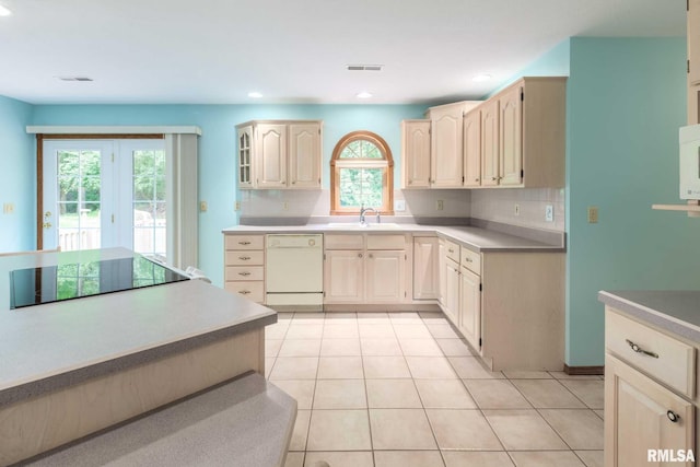 10415 Chayla Rd, Marion, IL 62959 - kitchen featuring black electric cooktop, white dishwasher, decorative backsplash, light tile patterned flooring, and light brown cabinets