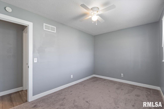 3518 W Garfield St, Davenport, IA 52804 - carpeted spare room featuring ceiling fan, a textured ceiling, and a smoke detector