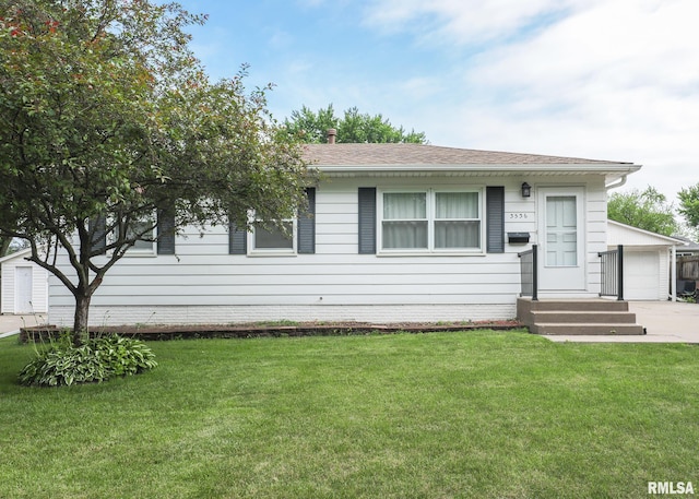 3536 W Hayes St, Davenport, IA 52804 - view of front of property with a front yard, a garage, and a shingled roof