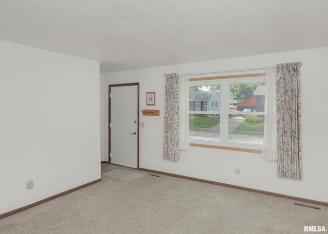 3536 W Hayes St, Davenport, IA 52804 - spare room featuring light colored carpet and baseboards