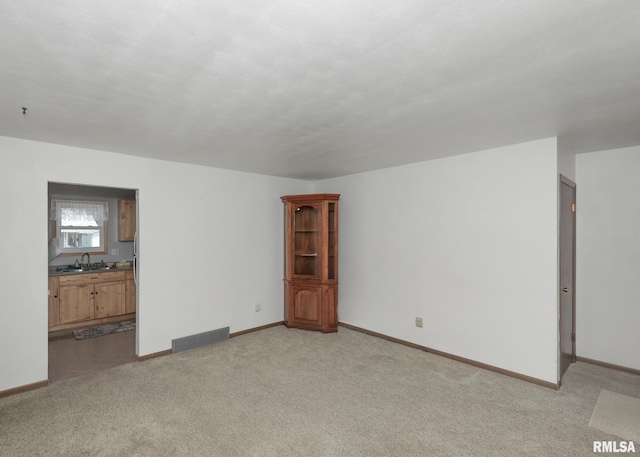3536 W Hayes St, Davenport, IA 52804 - unfurnished living room featuring light colored carpet