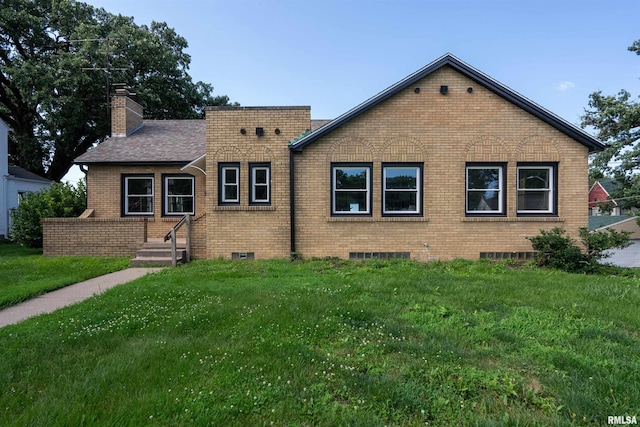 922 W Lombard St, Davenport, IA 52804 - view of front facade featuring brick siding, a front yard, and a chimney