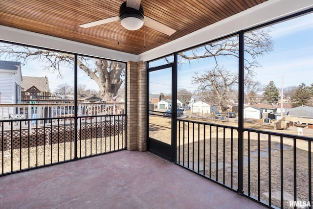922 W Lombard St, Davenport, IA 52804 - unfurnished sunroom with a residential view and ceiling fan