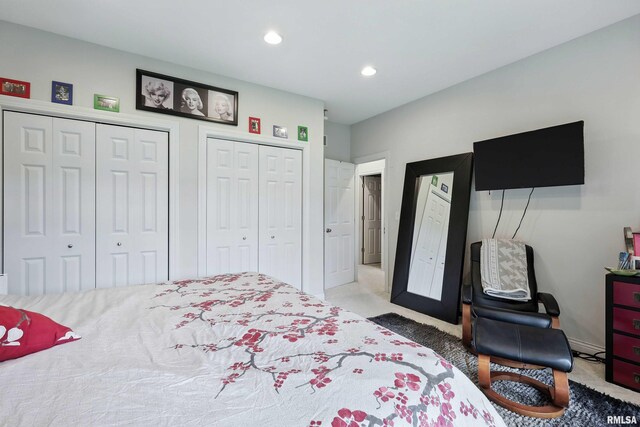 21945 Great River Rd, Le Claire, IA 52753 - carpeted bedroom with multiple closets and recessed lighting