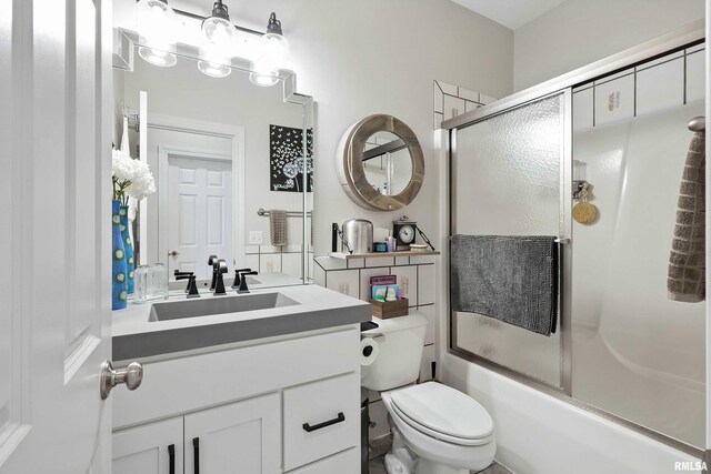 21945 Great River Rd, Le Claire, IA 52753 - bathroom featuring bath / shower combo with glass door and vanity