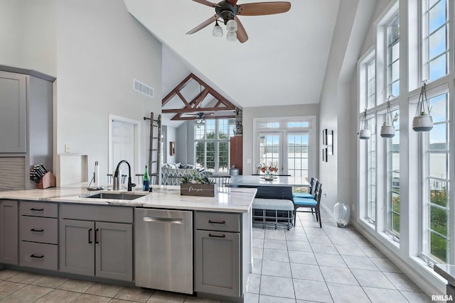 21945 Great River Rd, Le Claire, IA 52753 - kitchen featuring gray cabinets, dishwasher, high vaulted ceiling, a ceiling fan, and light tile patterned floors