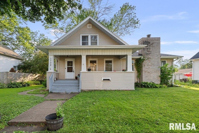 1732 36th St, Rock Island, IL 61201 - bungalow-style home featuring a porch and a chimney