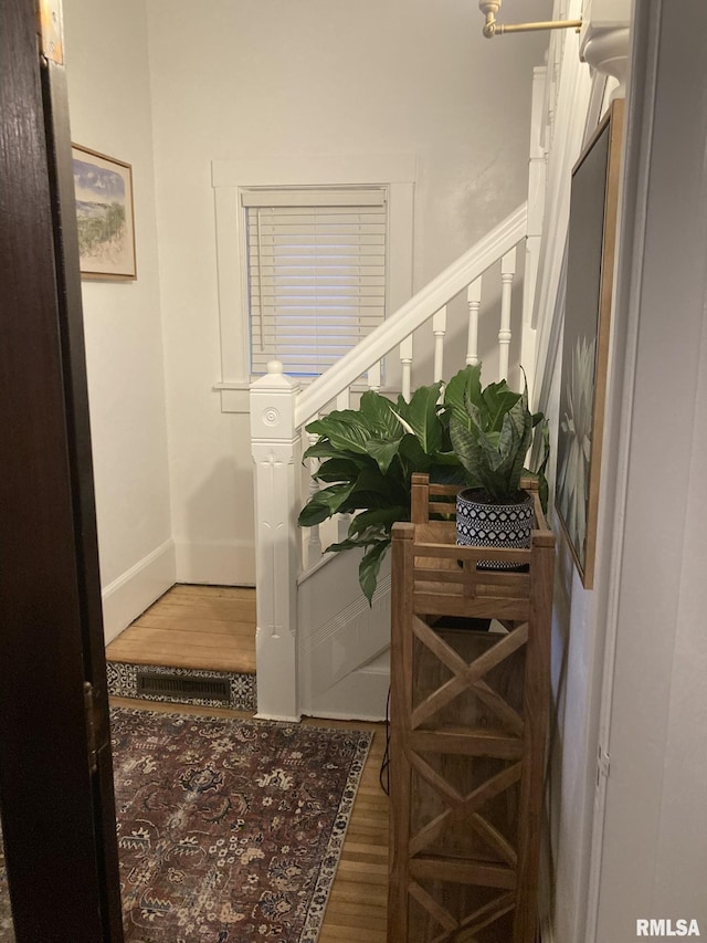 224 S Henderson St, Toulon, IL 61483 - hallway with wood finished floors and baseboards