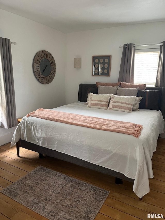 224 S Henderson St, Toulon, IL 61483 - bedroom with hardwood / wood-style floors
