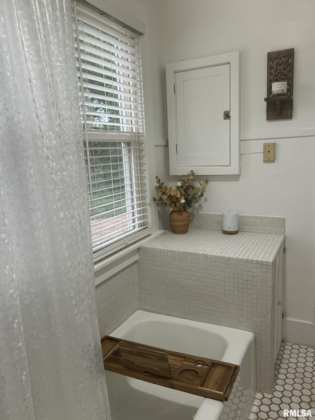 224 S Henderson St, Toulon, IL 61483 - full bath featuring a bath and tile patterned flooring