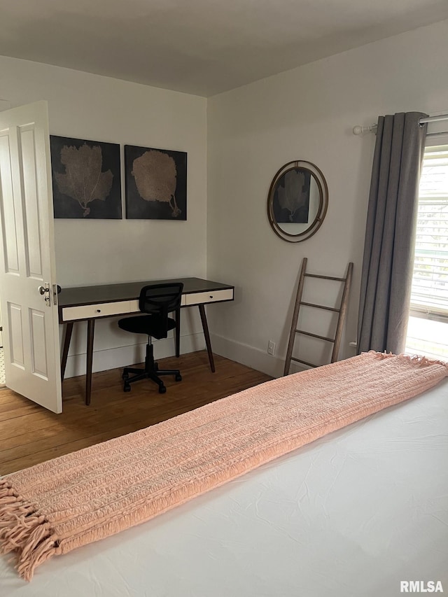224 S Henderson St, Toulon, IL 61483 - bedroom featuring wood finished floors and baseboards