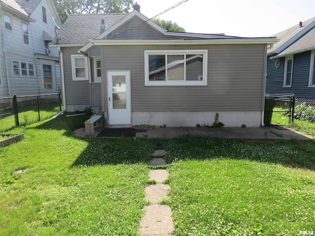 312 N 3rd St, Clinton, IA 52732 - back of house featuring a fenced backyard